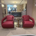 Cream Leather Sofa with Dark High-Gloss Wood Panels, Monogram Cushions and Metal Base Trim